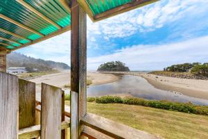 a view of the beach from a house window at Neskowin Resort Unit #203 in Neskowin