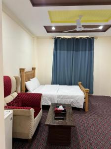 Ένα ή περισσότερα κρεβάτια σε δωμάτιο στο Yasin Heaven Star Hotel