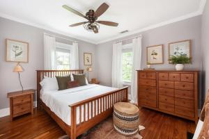 a bedroom with a bed and a ceiling fan at Harvest Moon in Atlanta