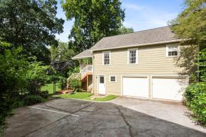 a house with two garage doors in a driveway at Harvest Moon in Atlanta