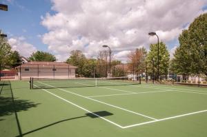 a tennis court with two tennis nets on it at Gorgeous Condos at Thousand Hills - Heart of Branson - Spacious and Affordable in Branson