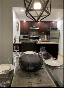a dining room with a table with chairs and wine glasses at Quiet & Cozy Ski-In Out, Hot tub, pool in Whistler
