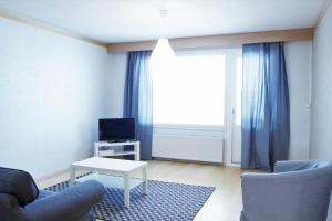 Μια τηλεόραση ή/και κέντρο ψυχαγωγίας στο Spacious Apartment for 5