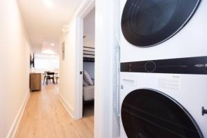 a washer and dryer in a room with a dining room at 3 BDR Renovated Condo The Beach1 block in Wildwood