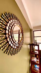 a mirror hanging on a wall in a room at Aqui y Ahora in Pisac