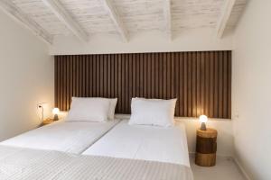Postel nebo postele na pokoji v ubytování Sole al Mare Villa + 25 fotografií