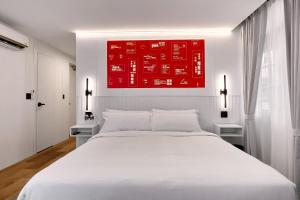 Ένα ή περισσότερα κρεβάτια σε δωμάτιο στο Casa Guogu by AmazINN Places 2f