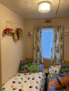 Ένα ή περισσότερα κρεβάτια σε δωμάτιο στο TH caravans The Promenade