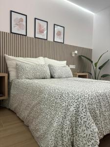 Ένα ή περισσότερα κρεβάτια σε δωμάτιο στο Alojamiento MEL BEACH