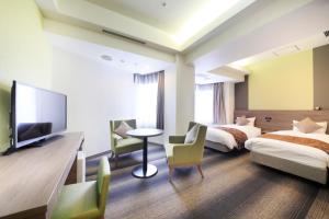 TV a/nebo společenská místnost v ubytování Hotel Sunshine Utsunomiya