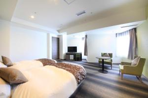 TV a/nebo společenská místnost v ubytování Hotel Sunshine Utsunomiya