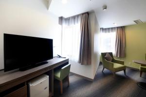 TV a/nebo společenská místnost v ubytování Hotel Sunshine Utsunomiya