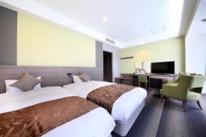 Postel nebo postele na pokoji v ubytování Hotel Sunshine Utsunomiya
