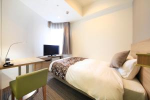 Postel nebo postele na pokoji v ubytování Hotel Sunshine Utsunomiya