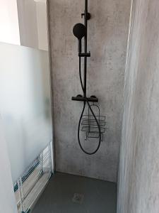 a hallway with a bird cage hanging from a wall at la ferme du renard et son gîte 