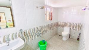 a bathroom with a sink and a toilet at ELO House - Spacious 2BHK Apartment with Kitchen, Malleswaram in Bangalore +14 photos