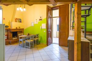 a kitchen with a table and a dining room at E-Home in Volla