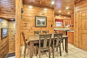 a dining room with a table and chairs at Simply Serene in the Smokies in Gatlinburg