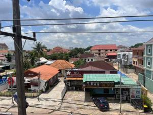 a view of a small town with buildings at FUBON World Hostel in Ban That-Louang