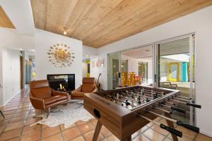 a living room with a foosball table at The Ricardo! Mid-Century Villa with Saltwater Pool in Palm Springs