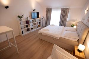 Ένα ή περισσότερα κρεβάτια σε δωμάτιο στο Charmantes City Apartment mit Domblick & Stellplatz