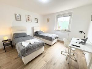 Postel nebo postele na pokoji v ubytování Essen Stilvolles 2 Zimmer Apartment in City und Messenähe