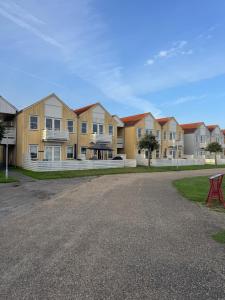 a row of houses on a street at Udsigten in Rudkøbing