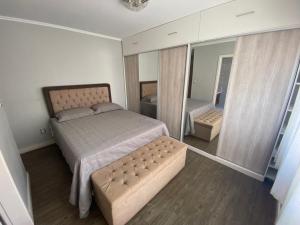 Ένα ή περισσότερα κρεβάτια σε δωμάτιο στο Cobertura Moinhos de Vento