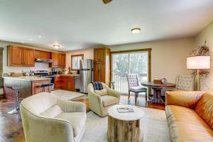 a living room with a couch and a table at Walk to River Couples Retreat in Kintnersville! in Kintnersville