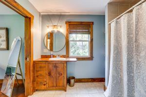 a bathroom with a sink and a mirror at Walk to River Couples Retreat in Kintnersville! in Kintnersville +17 photos