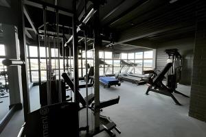 a gym with several treadmills and machines in it at Flat 602 - Mn Concept in Marília