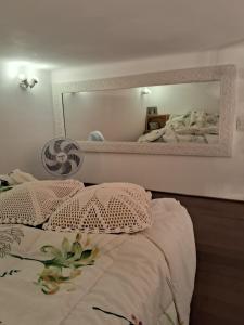 Ένα ή περισσότερα κρεβάτια σε δωμάτιο στο Loft dentro do Palácio Quitandinha +16 φωτογραφίες