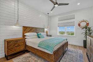 a bedroom with a bed and a window at Sunset Shores Escape in Port Aransas +64 photos