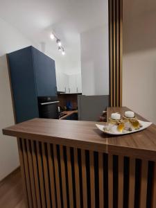 a kitchen with a table with a plate of food on it at Apartman Milica in Herceg-Novi +4 photos