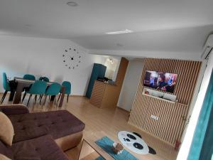 a living room with a couch and a table at Apartman Milica in Herceg-Novi