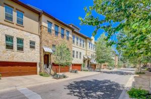 an empty street in front of a brick building at Modern Luxury Townhouse with Private Elevator and Rooftop Terrace in Georgetown