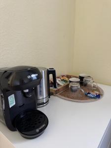 a coffee maker sitting on top of a counter at Gasthof Hochstein in Meschede