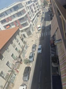 a city street with cars parked on the street at Appartement Valeria in Saint-Laurent-du-Var