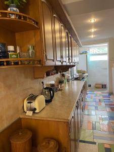 a kitchen with a counter with a toaster on it at Yellow villa in Gonio in Gonio +24 photos