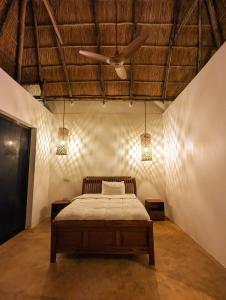 a bedroom with a bed and a ceiling at Waterfall Halal Retreat Pemba Island Zanzibar in Mkoani