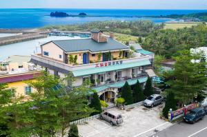 an overhead view of a building with a river in the background at Sansendai Sea View B&B in Chenggong