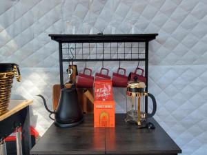 a table with a coffee maker and a box on it at NEW Romantic CLIFF GLAMPING w Vista Views of WHITE RIVER, Minutes to fishing and hikes! 