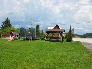 a park with a playground with a play equipment at Pensiunea Gaby in Dâmbovicioara