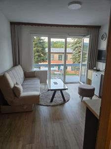 a living room with a couch and a coffee table at Urban Home Visoko in Visoko +26 photos