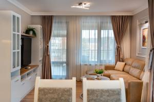 TV a/nebo společenská místnost v ubytování Family Boutique Residence-Free Parking