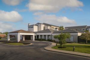 a rendering of the front of a building at Courtyard by Marriott Louisville East in Louisville