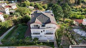 an aerial view of a white house with a roof at Villa Perikli in Delvinë