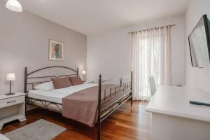 Ένα ή περισσότερα κρεβάτια σε δωμάτιο στο Villa La Vigna Blu +42 φωτογραφίες