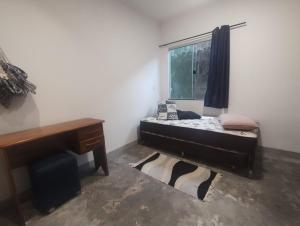 Ένα ή περισσότερα κρεβάτια σε δωμάτιο στο Casa Tupi