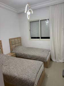 Кровать или кровати в номере Asilah Marina Golf +9 фотографий